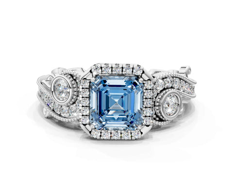 White gold Fancy Blue Asscher Cut Halo Diamond Ring with Milgrain and Bezel Accents on a Split Shank Band