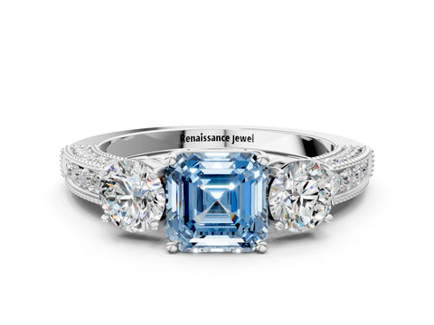 White gold Fancy Blue Asscher Cut Three-Stone Diamond Ring with Pavé Band and Four-Prong Setting