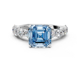 White gold Fancy Blue Asscher  Diamond Prong Setting with Side Stones on a Pave Band