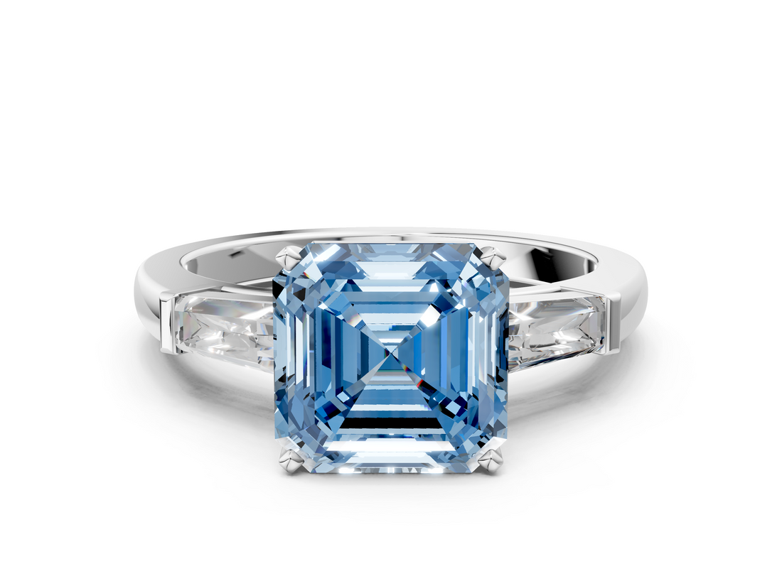 White gold Fancy Blue Asscher  Solitaire with Tapered Baguette Side Stones on a Classic Band with Four-Prong Setting