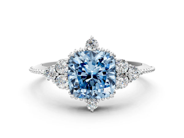 Platinum Fancy Blue Cushion Cut Brilliant Diamond with Cluster Setting on a Beaded Band and Four-Prong Setting