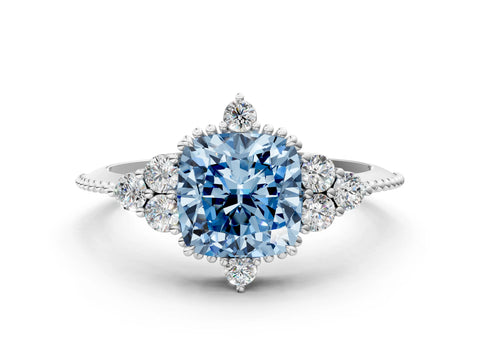 White gold Fancy Blue Cushion Cut Brilliant Diamond with Cluster Setting on a Beaded Band and Four-Prong Setting