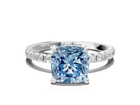 White gold Fancy Blue Cushion Cut Diamond Brilliant Solitaire Ring with Pavé Band and Four-Prong Setting