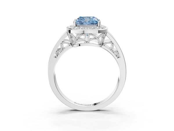 White gold Fancy Blue Cushion Cut Diamond Halo Ring with Split Shank and Bezel Accents and Prong Setting