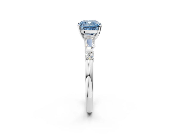 White gold Fancy Blue Cushion  Cut Diamond Ring with Baguette Side Stones, Channel Set Band, and Four-Prong Setting
