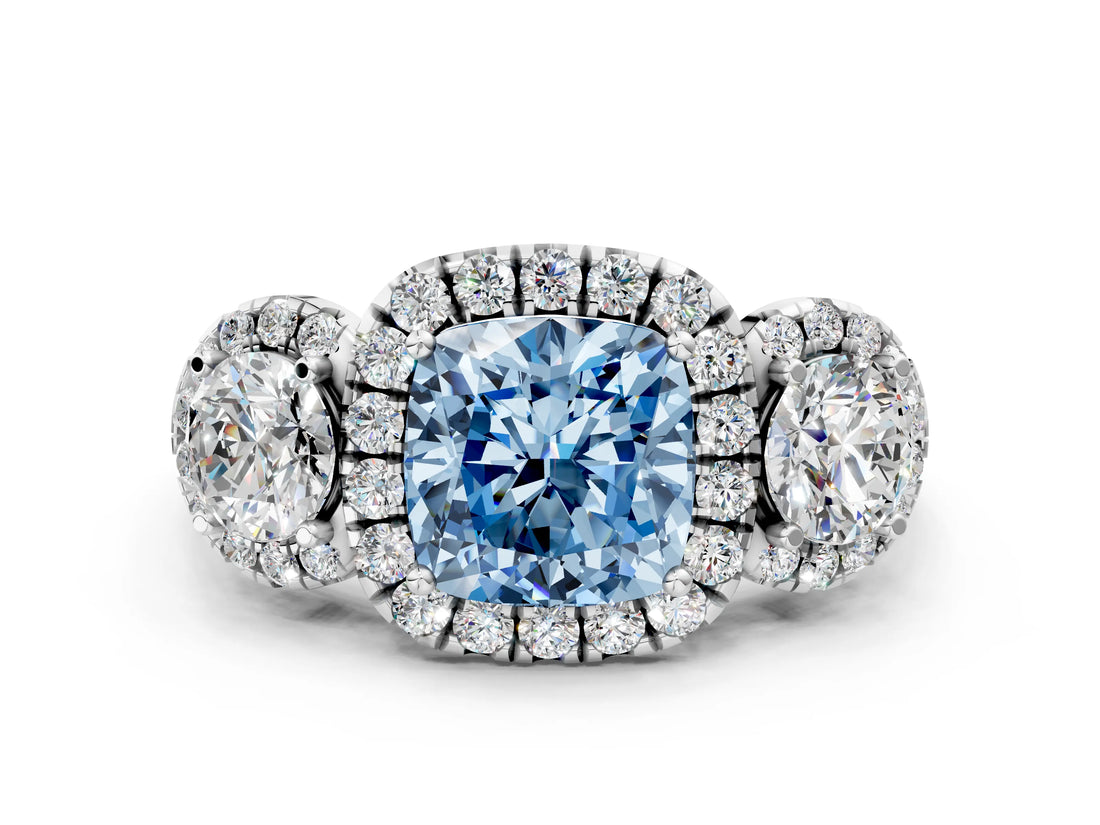 White gold Fancy Blue Cushion Cut Diamond Three-Stone Halo Ring with Prong Setting and Pavé Accents