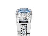White gold Fancy Blue Cushion Cut Diamond Three-Stone Ring with Channel Set Band and Four-Prong Setting_89