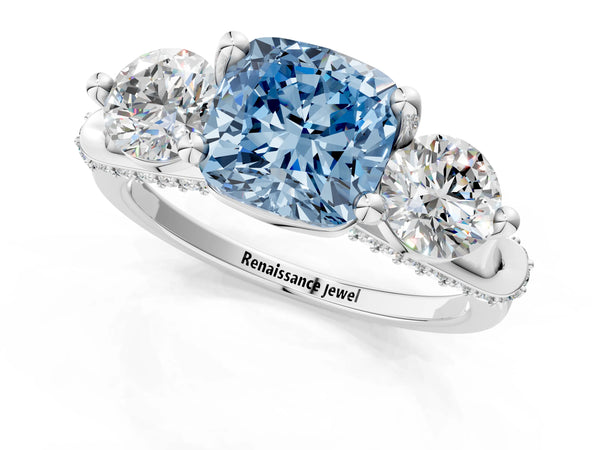 White gold Fancy Blue Cushion Cut Diamond Three-Stone Ring with Prong Setting and Pavé Band