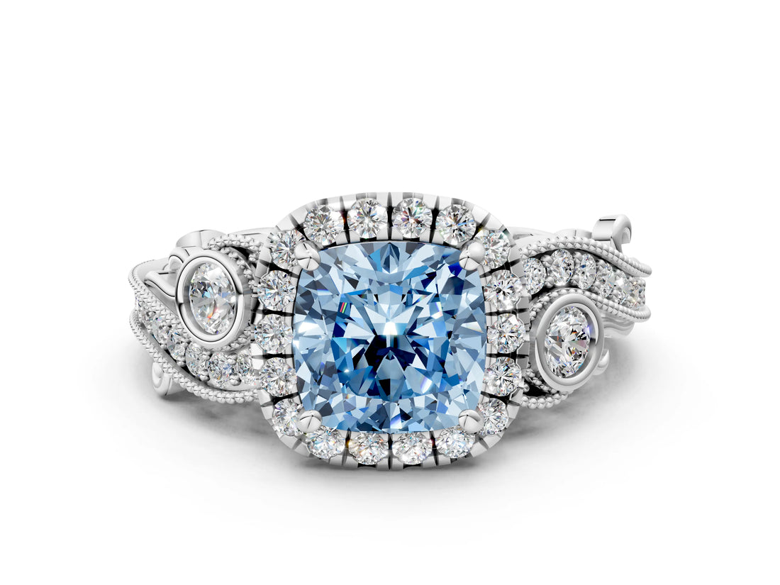 White gold Fancy Blue Cushion Cut Halo Diamond Ring with Milgrain and Bezel Accents on a Split Shank Band