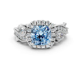 White gold Fancy Blue Cushion Cut Halo Diamond Ring with Milgrain and Bezel Accents on a Split Shank Band