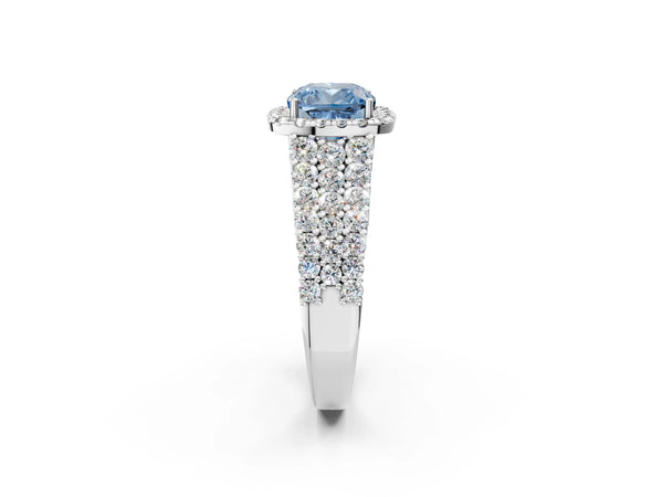 White gold Fancy Blue Cushion Cut Halo Pavé Diamond Engagement Ring with Split Shank and Four-Prong Setting