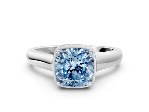 White gold Fancy Blue Cushion Cut Solitaire Diamond Engagement Ring with Four-Prong Setting and Tapered Band