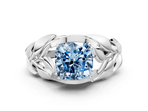 White gold Fancy Blue Cushion Cut Solitaire Leaf-Inspired Engagement Ring with Prong Setting