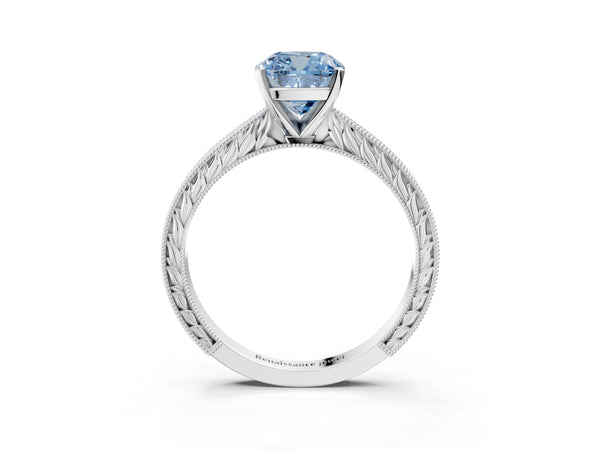 Platinum Fancy Blue Cushion Cut Solitaire Milgrain Engraved Band with Four-Prong Setting
