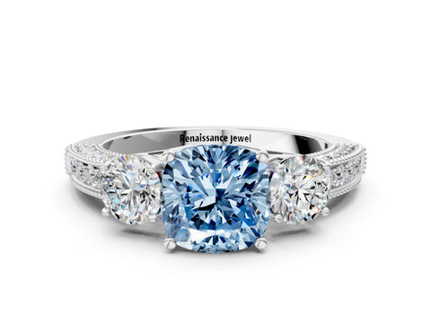 White gold Fancy Blue Cushion Cut Three-Stone Diamond Ring with Pavé Band and Four-Prong Setting
