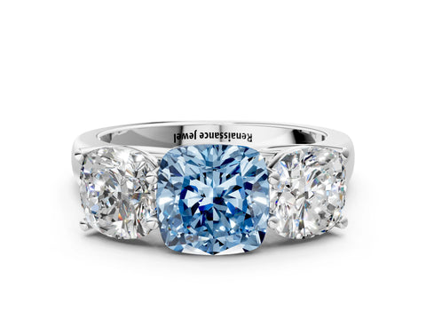 White gold Fancy Blue Cushion Cut Three-Stone Diamond Ring with Prong Setting on a Classic Band