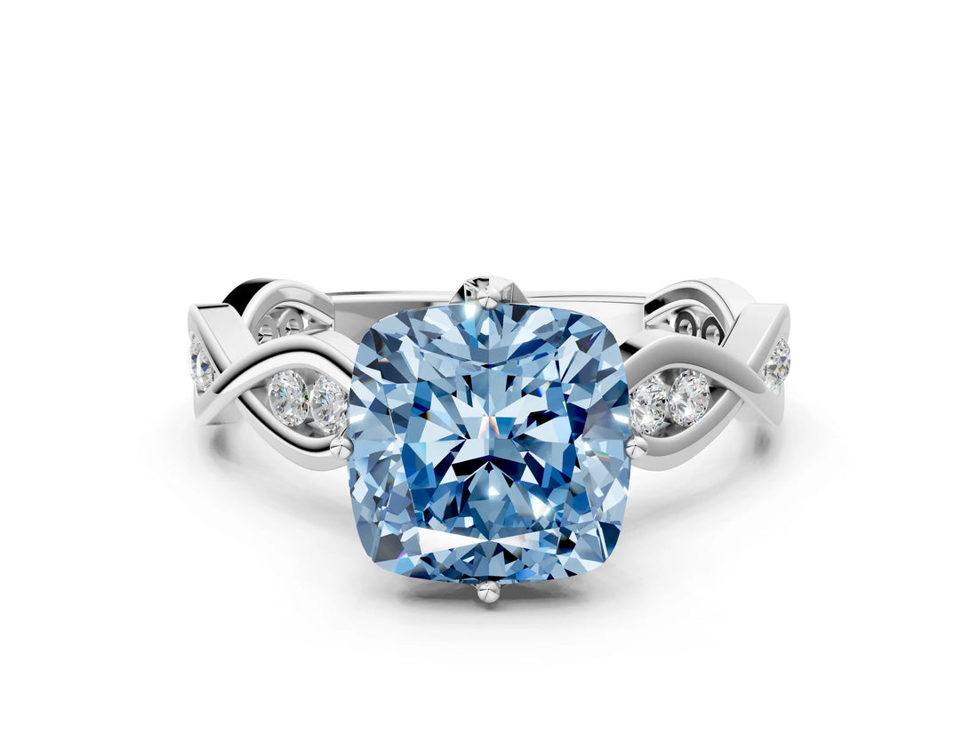 White gold Fancy Blue Cushion  Solitaire Twist Band with Leaf Prong Setting