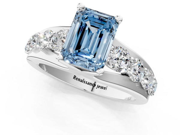 White gold Fancy Blue Emerald  Brilliant Solitaire with Side Stones on a Pave Band and Four-Prong Setting