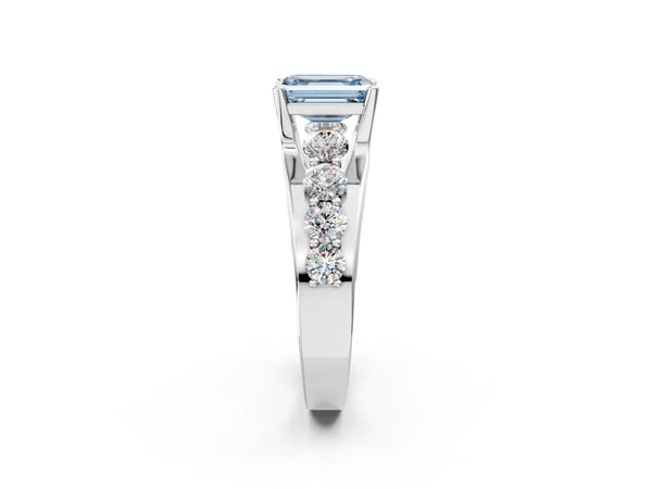 White gold Fancy Blue Emerald  Brilliant Solitaire with Side Stones on a Pave Band and Four-Prong Setting