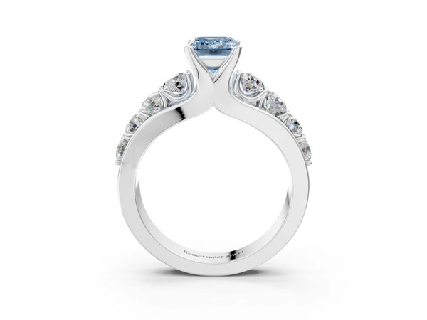 White gold Fancy Blue Emerald  Brilliant Solitaire with Side Stones on a Pave Band and Four-Prong Setting