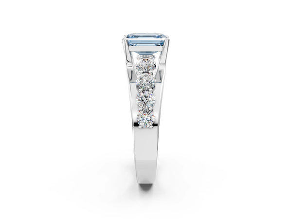 White gold Fancy Blue Emerald  Brilliant Solitaire with Side Stones on a Pave Band and Four-Prong Setting