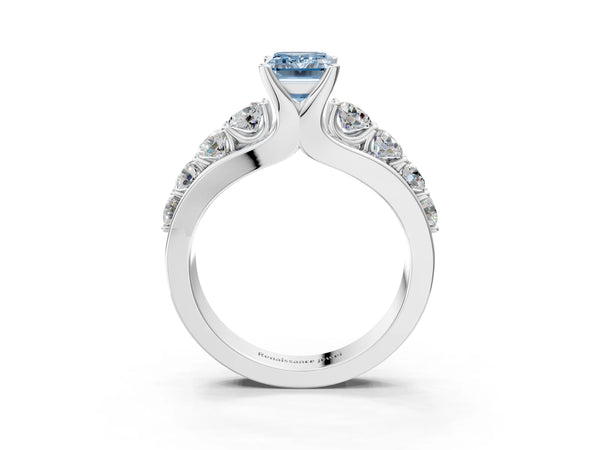 White gold Fancy Blue Emerald  Brilliant Solitaire with Side Stones on a Pave Band and Four-Prong Setting