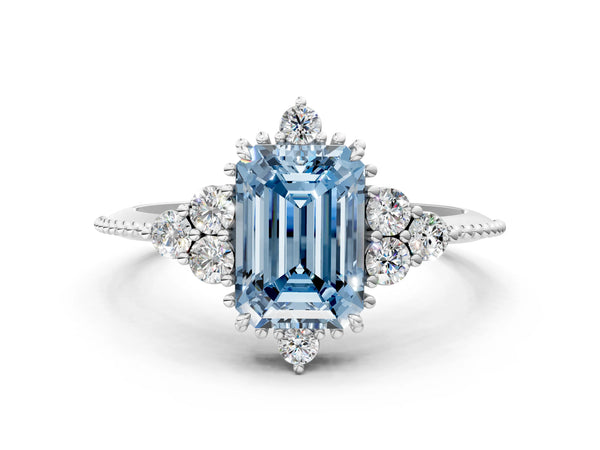 Platinum Fancy Blue Emerald Cut Brilliant Diamond with Cluster Setting on a Beaded Band and Four-Prong Setting