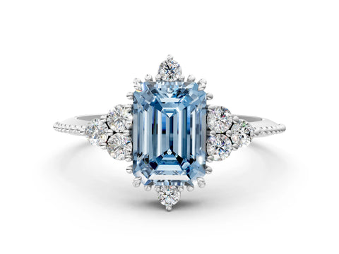 White gold Fancy Blue Emerald Cut Brilliant Diamond with Cluster Setting on a Beaded Band and Four-Prong Setting