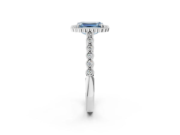 White gold Fancy Blue Emerald Cut Cut Halo Pavé Solitaire Ring with Milgrain Band