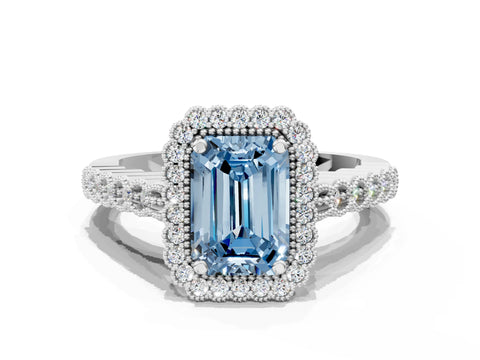 White gold Fancy Blue Emerald Cut Cut Halo Pavé Solitaire Ring with Milgrain Band
