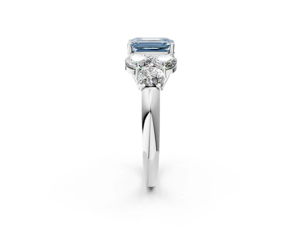 Platinum Fancy Blue Emerald  Cut Diamond Cluster Ring with Round Accent Stones and Prong Setting on a Classic Band