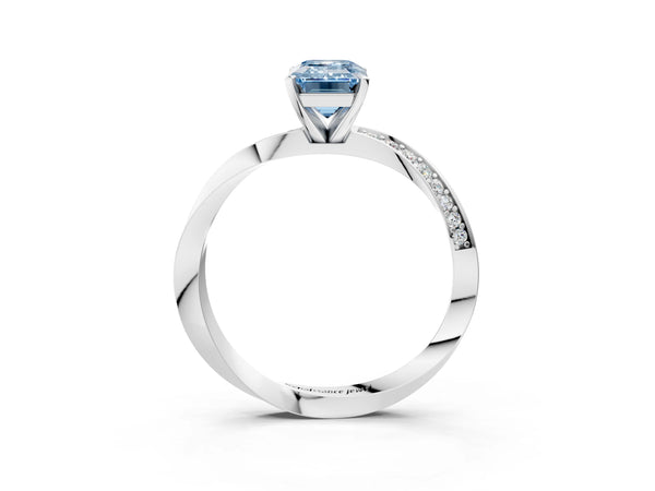 Platinum Fancy Blue Emerald Cut Diamond Engagement Ring with Side Stone Accents and Four-Prong Setting