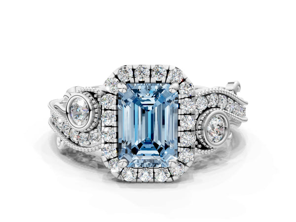 White gold Fancy Blue Emerald Cut Diamond Halo Ring with Milgrain Pavé Band and Four-Prong Setting
