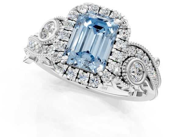 White gold Fancy Blue Emerald Cut Diamond Halo Ring with Milgrain Pavé Band and Four-Prong Setting