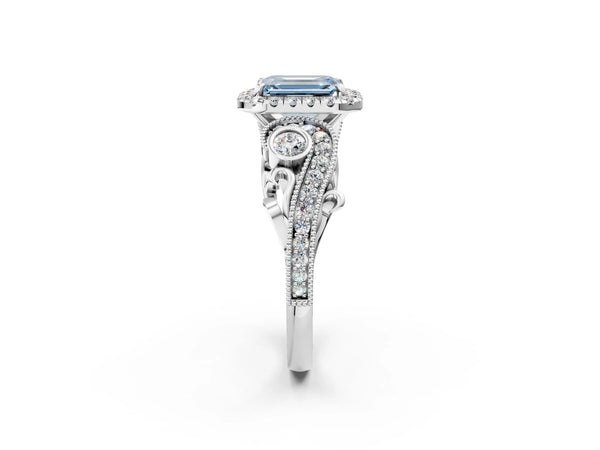 White gold Fancy Blue Emerald Cut Diamond Halo Ring with Milgrain Pavé Band and Four-Prong Setting