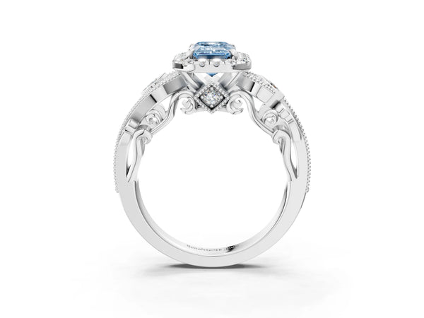 White gold Fancy Blue Emerald Cut Diamond Halo Ring with Milgrain Pavé Band and Four-Prong Setting