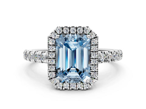 White gold Fancy Blue Emerald Cut Diamond Halo Ring with Pavé Band and Four-Prong Setting