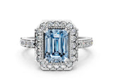 White gold Fancy Blue Emerald Cut Diamond Halo Ring with Pavé Band and Prong Setting