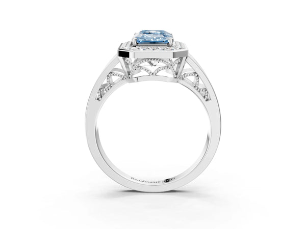 White gold Fancy Blue Emerald Cut Diamond Halo Ring with Split Shank and Bezel Accents and Prong Setting