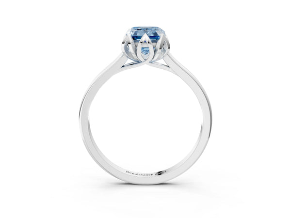 White gold Fancy Blue Emerald Cut Diamond Solitaire Ring with Flower Prong Setting and Classic Band