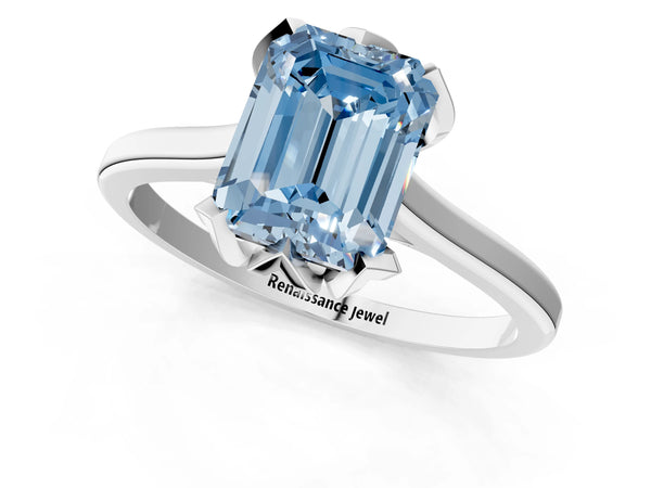 White gold Fancy Blue Emerald Cut Diamond Solitaire Ring with Flower Prong Setting and Classic Band
