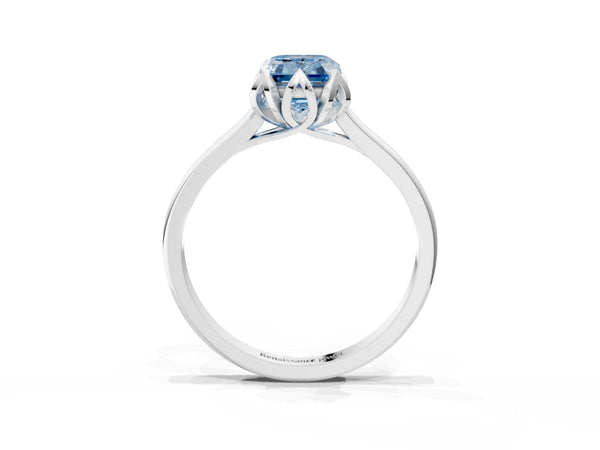 White gold Fancy Blue Emerald Cut Diamond Solitaire Ring with Flower Prong Setting and Classic Band