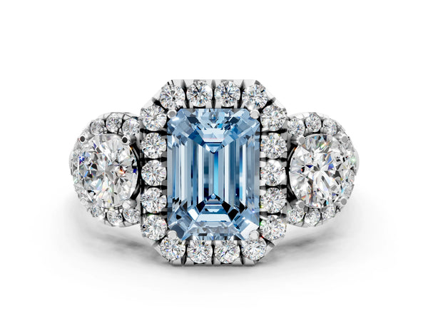 White gold Fancy Blue Emerald Cut Diamond Three-Stone Halo Ring with Prong Setting and Pavé Accents