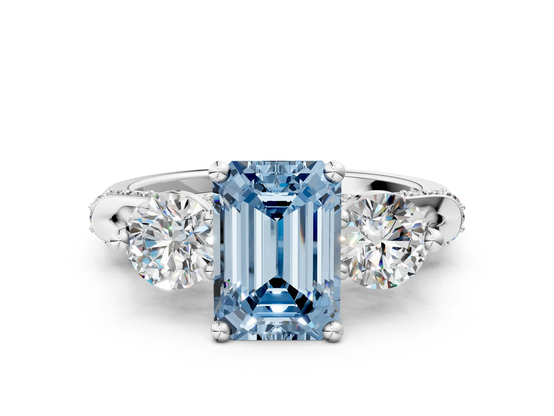 White gold Fancy Blue Emerald Cut Diamond Three-Stone Ring with Prong Setting and Pavé Band