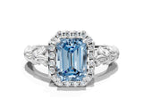 White gold Fancy Blue Emerald Cut Halo Diamond Solitaire with Filigree Band and Four-Prong Setting