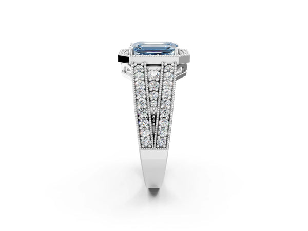 White gold Fancy Blue Emerald Cut Halo Diamond Split Shank Ring with Prong Setting