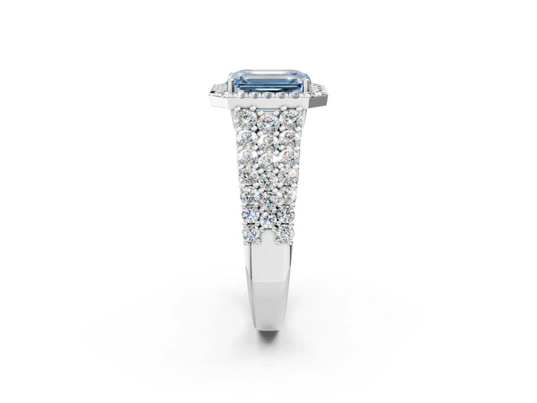 White gold Fancy Blue Emerald Cut Halo Pavé Diamond Engagement Ring with Split Shank and Four-Prong Setting