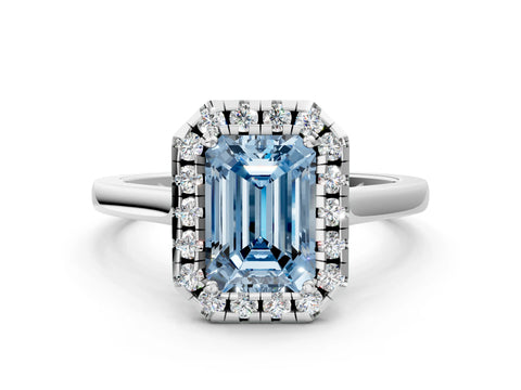 White gold Fancy Blue Emerald Cut Halo Round Diamond Solitaire Ring with Pavé Band and Four-Prong Setting