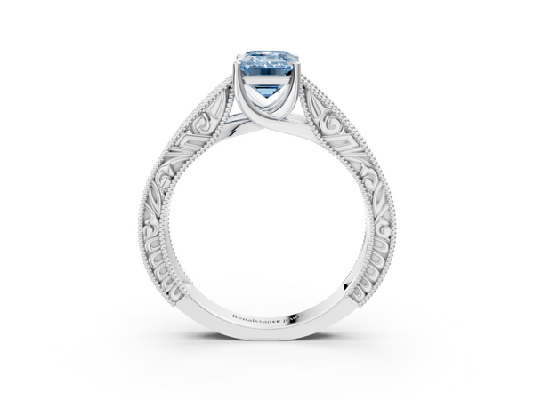 White gold Fancy Blue Emerald Cut Diamond Solitaire Ring with Engraved Band and Four-Prong Setting