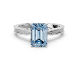 White gold Fancy Blue Emerald Cut Solitaire Milgrain Engraved Band with Four-Prong Setting